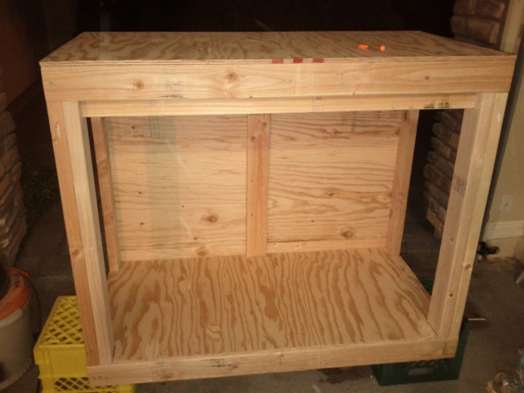 Reef tank stand with plywood floor, backing and tank bottom added to frame
